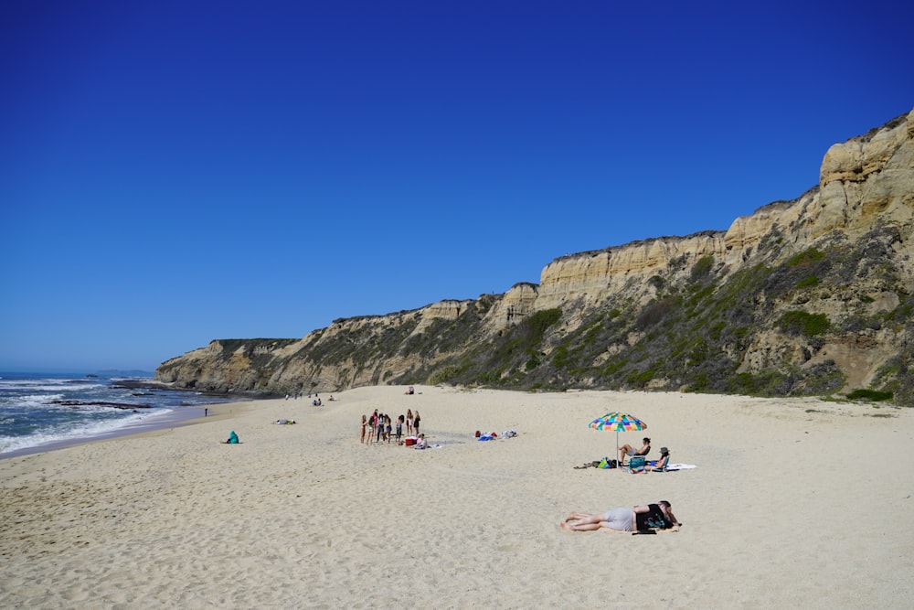 people on beach during daytime