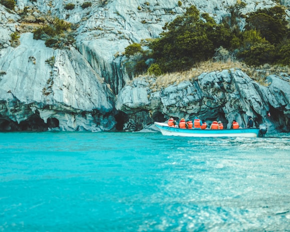 red and white boat on blue water