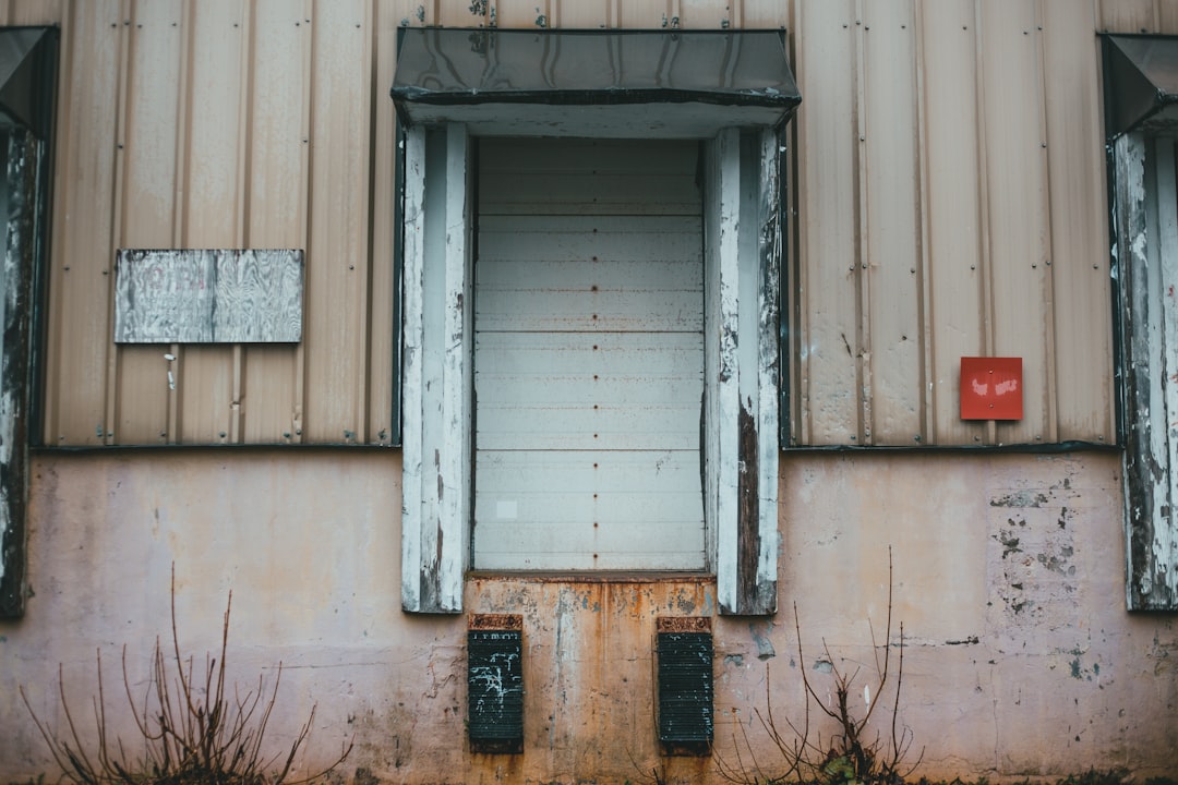 gray wooden window on white concrete wall