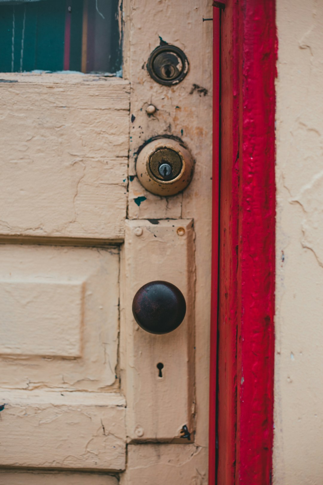 white wooden door with brass door knob