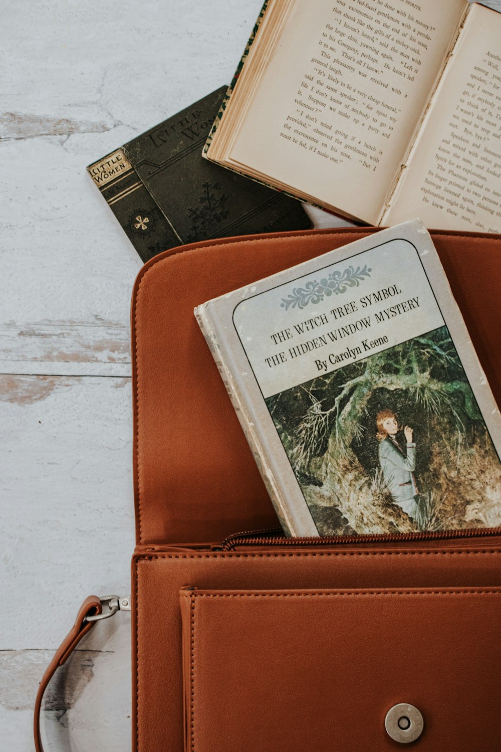 white and green card on brown leather wallet