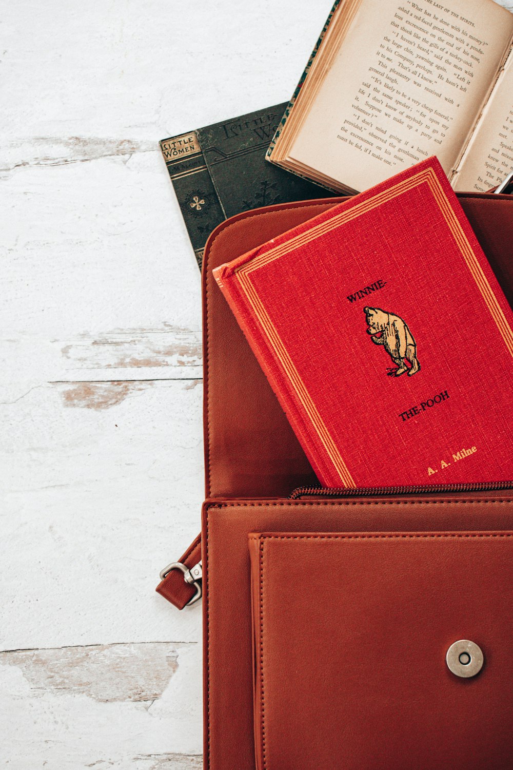 red leather wallet on white table