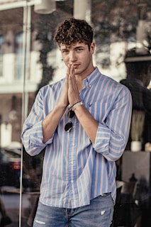 man in blue and white plaid dress shirt