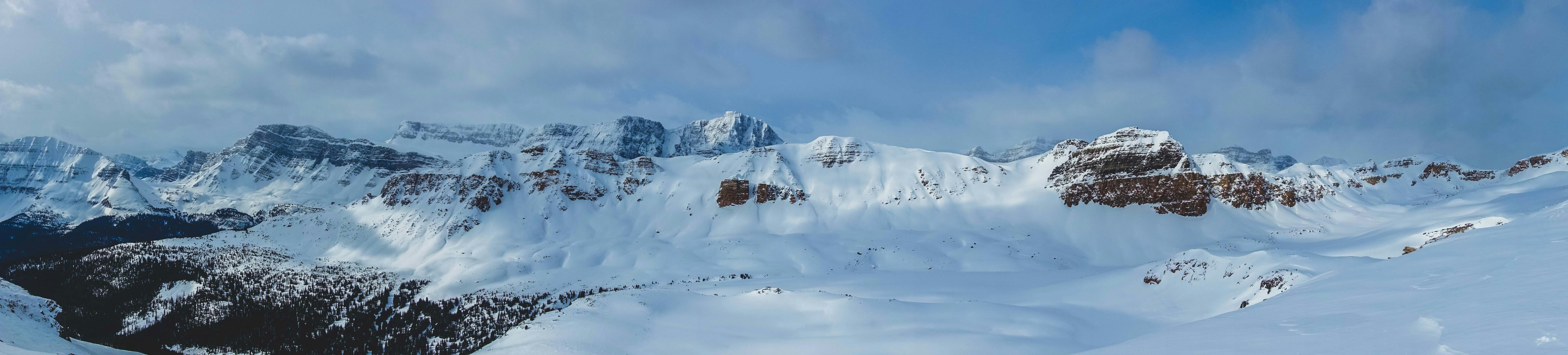 snow covered mountain under blue sky during daytime