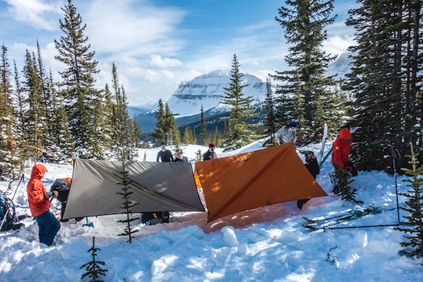 Group camping in snow-covered mountains