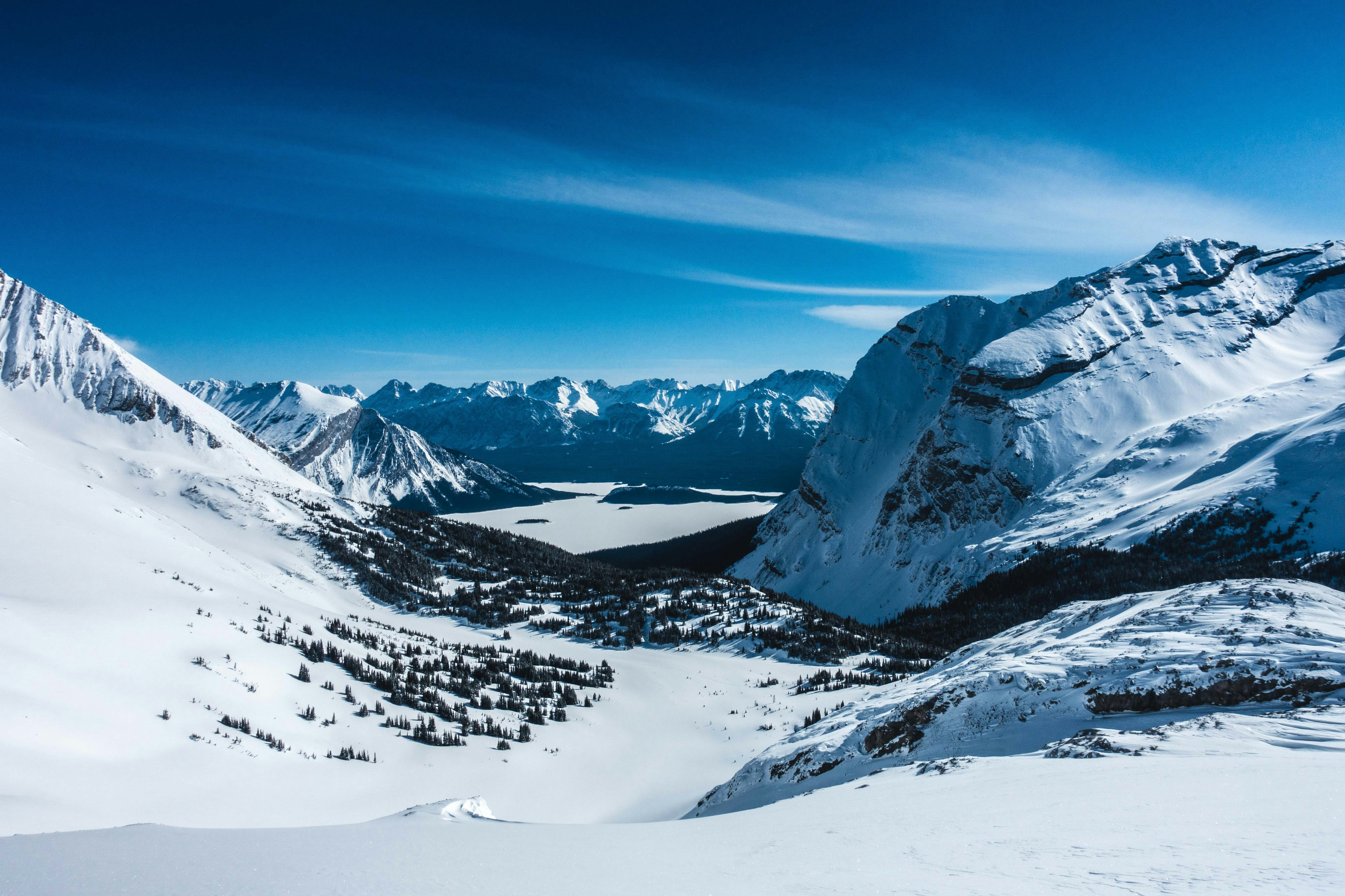 snow covered mountain under blue sky during daytime