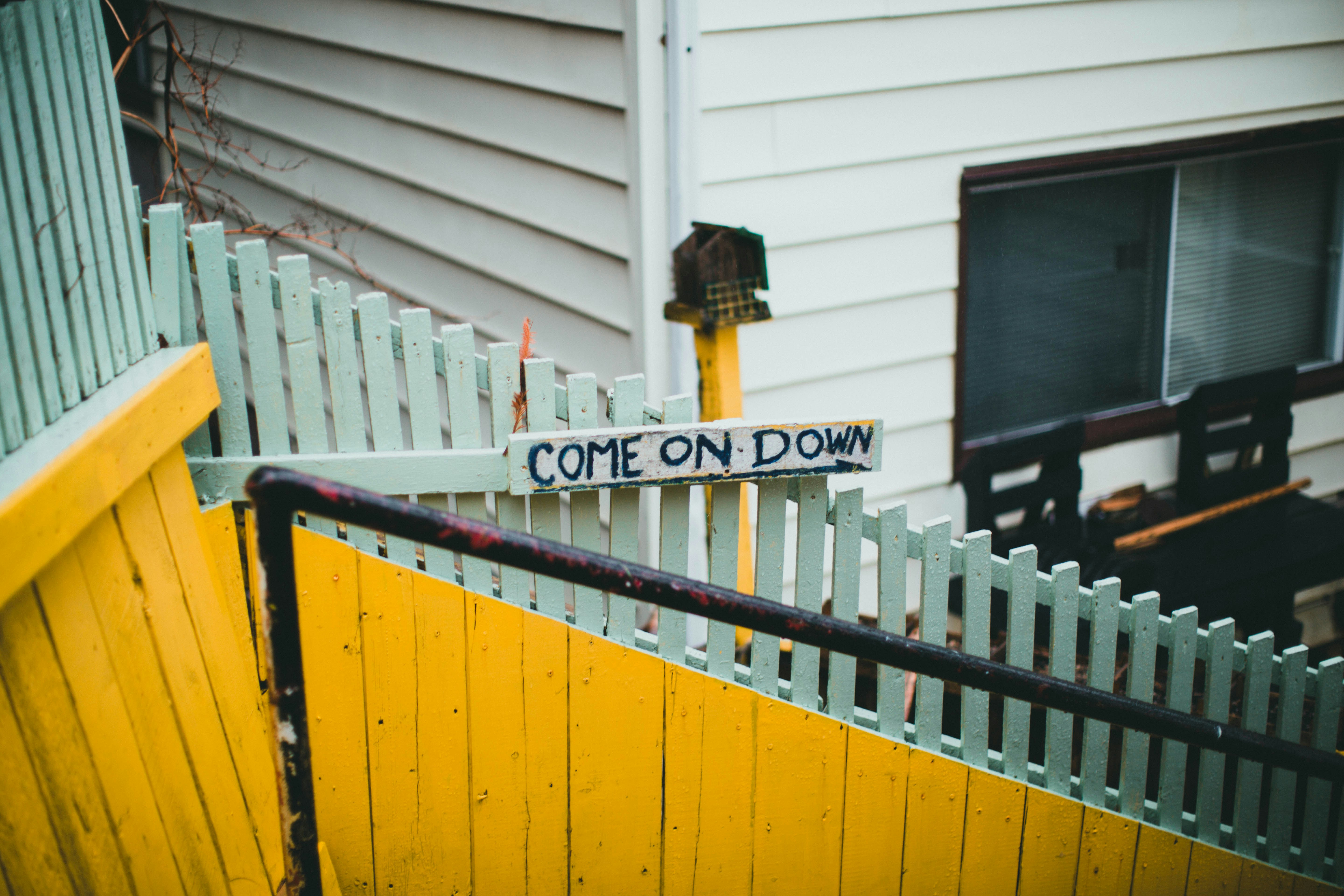 white wooden fence near white wooden fence