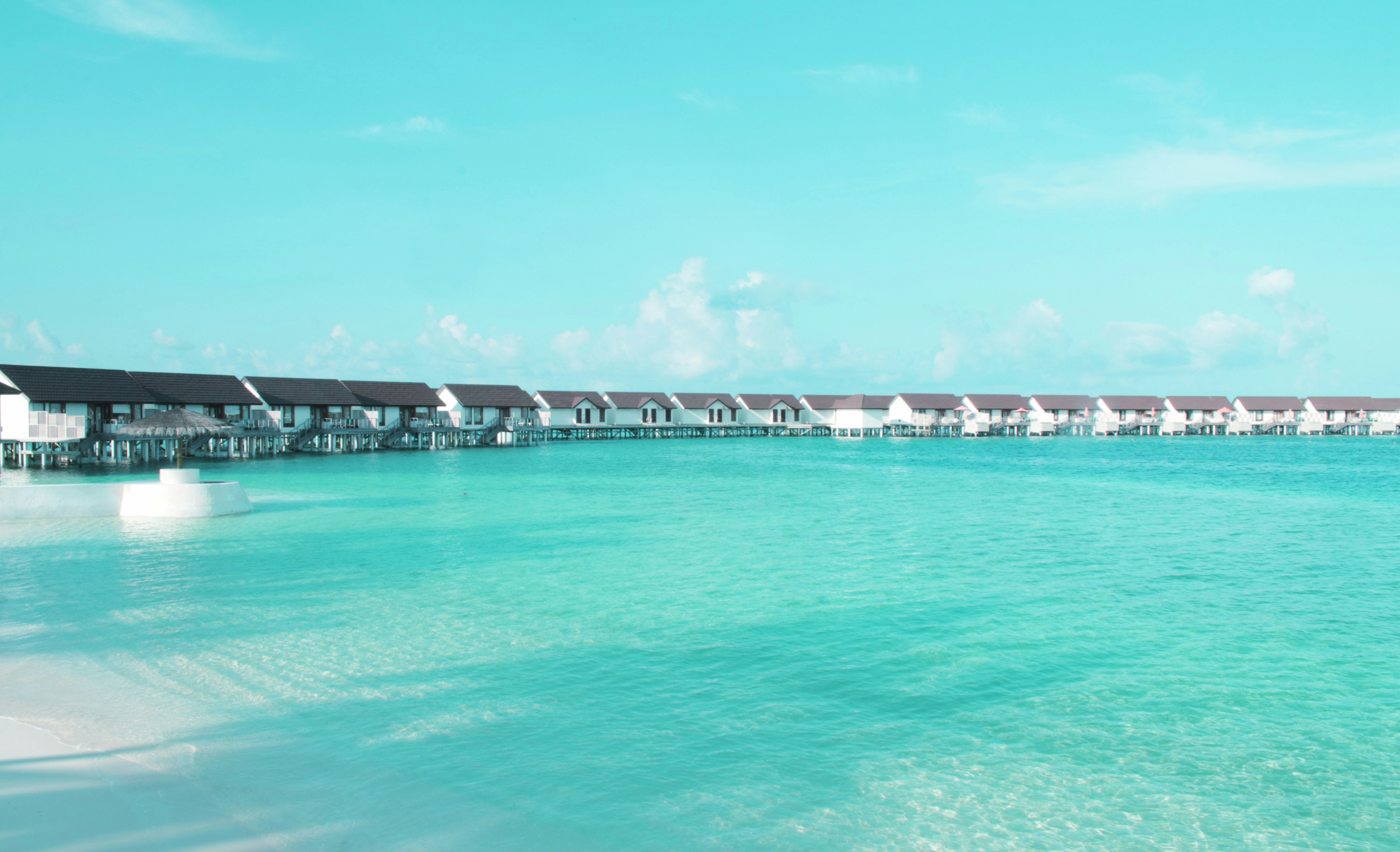 Overwater bungalows over the blue blue ocean