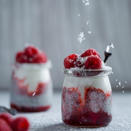 red and white ice cream on clear glass container