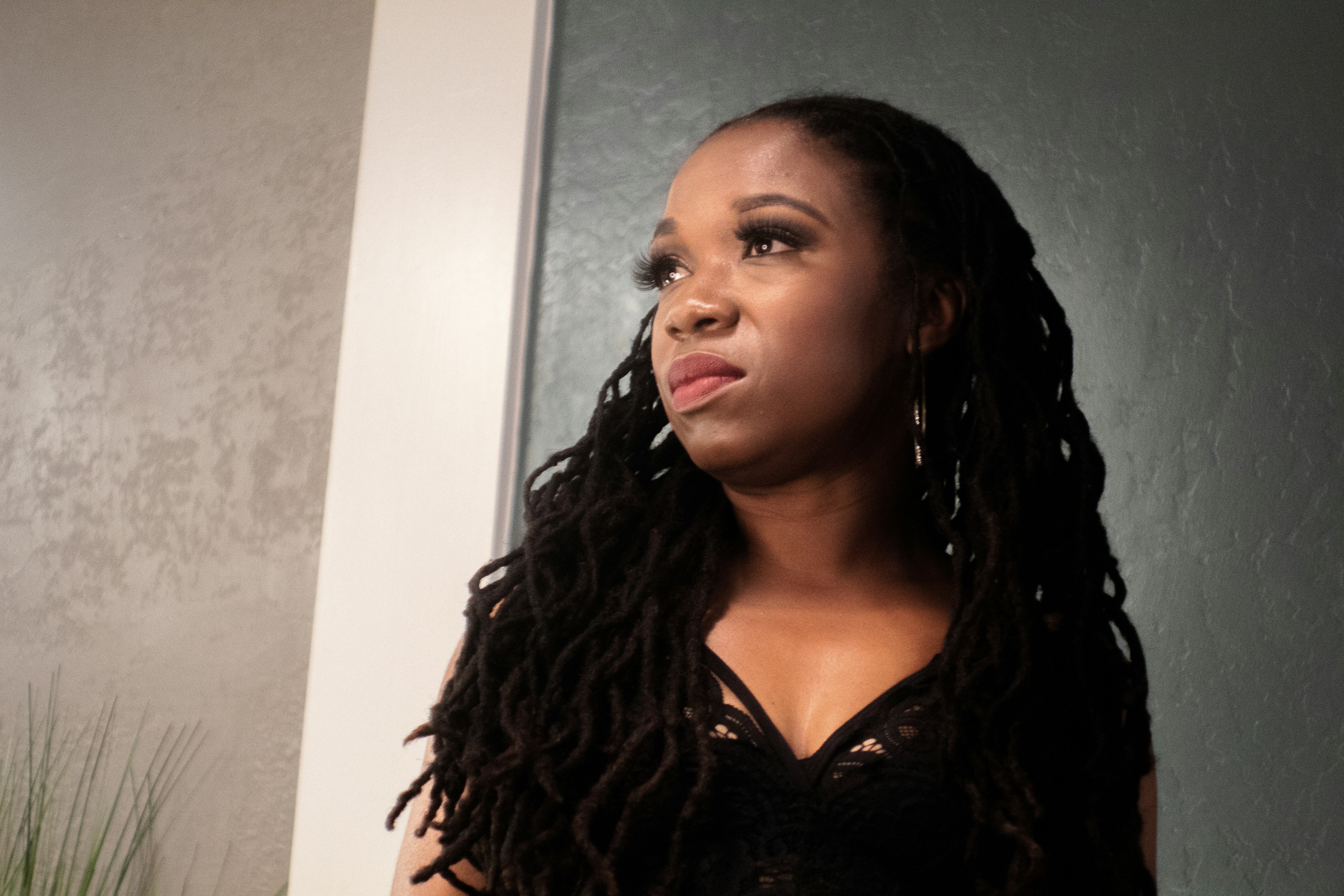 Woman in black v neck shirt