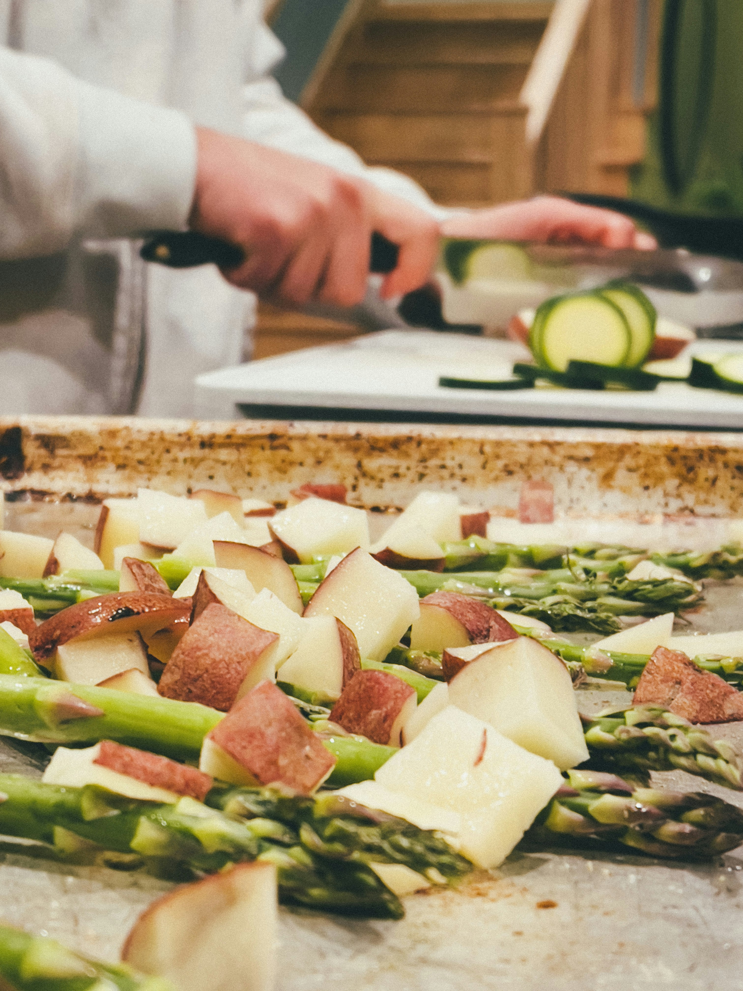 A person chops and prepares fresh vegetables 