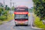 red and black bus on road during daytime