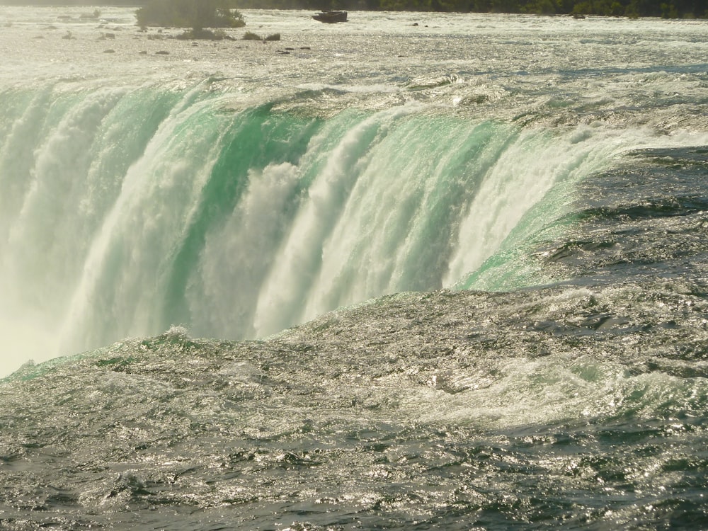 a large waterfall with water pouring out of it