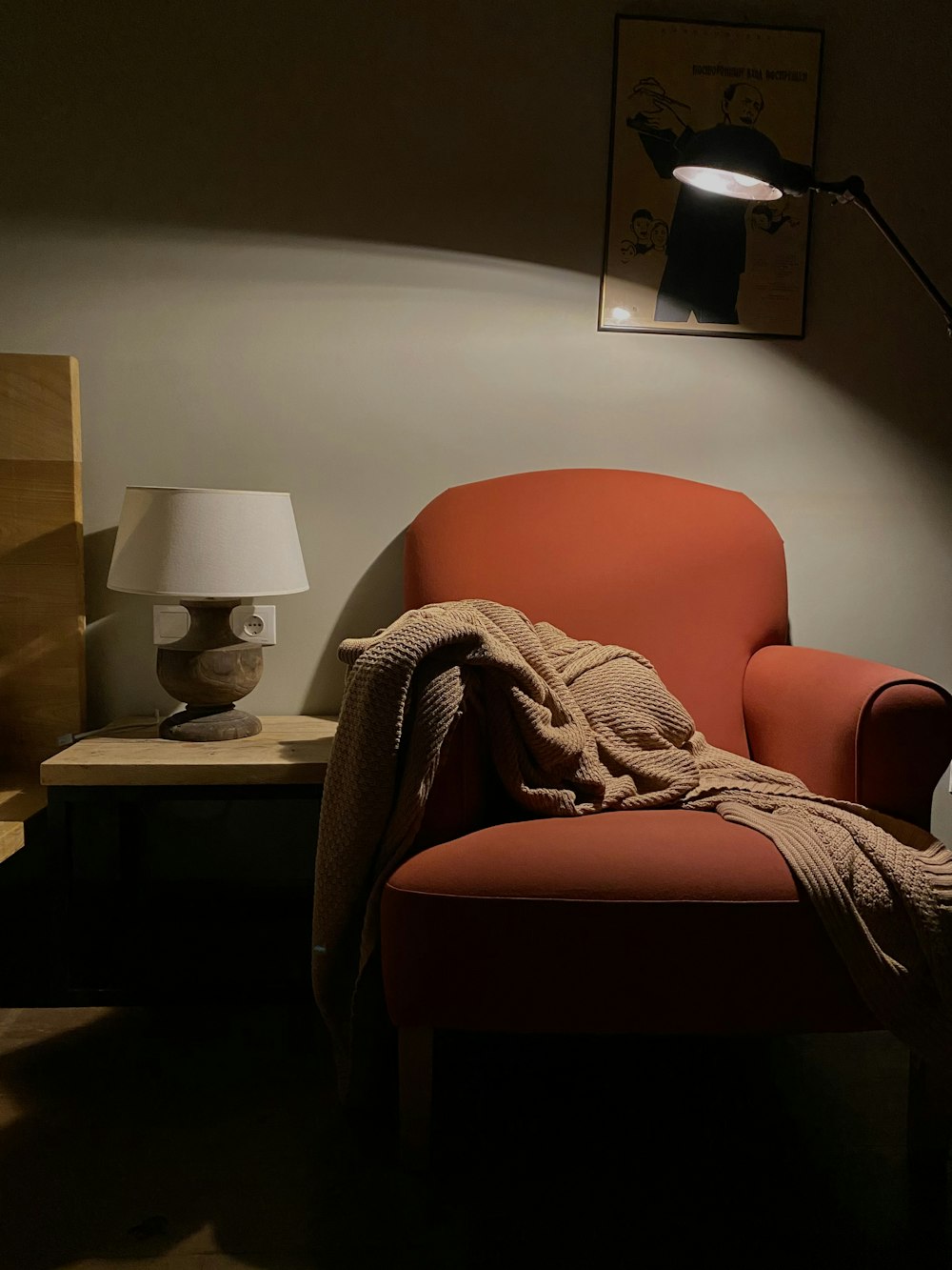 orange sofa chair beside table lamp