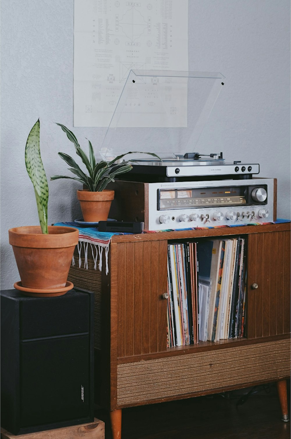 gray radio on brown wooden cabinet