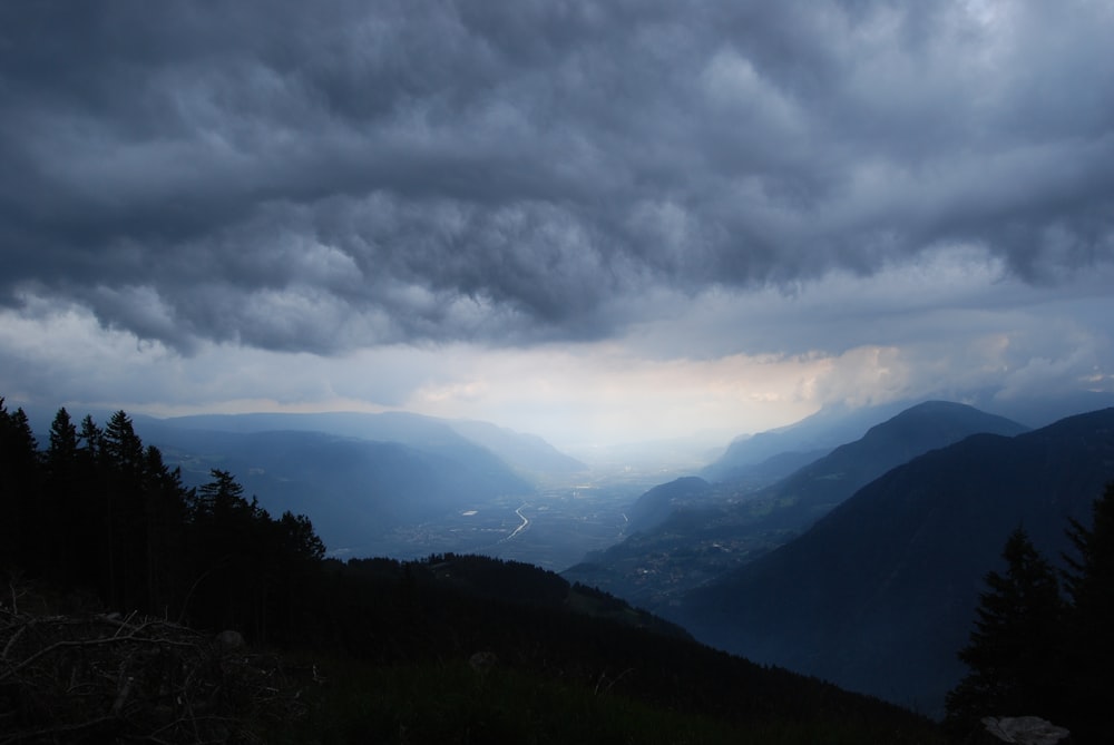 green mountains under white clouds during daytime