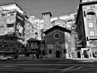 Before and after images of a restored historic building in a downtown area.