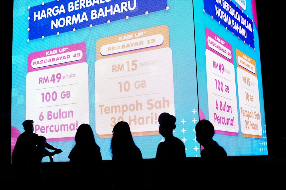 people sitting on chair in front of the stage