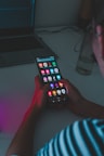 person holding black remote control