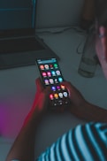 person holding black remote control
