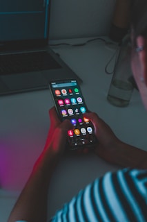 person holding black remote control
