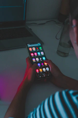 person holding black remote control