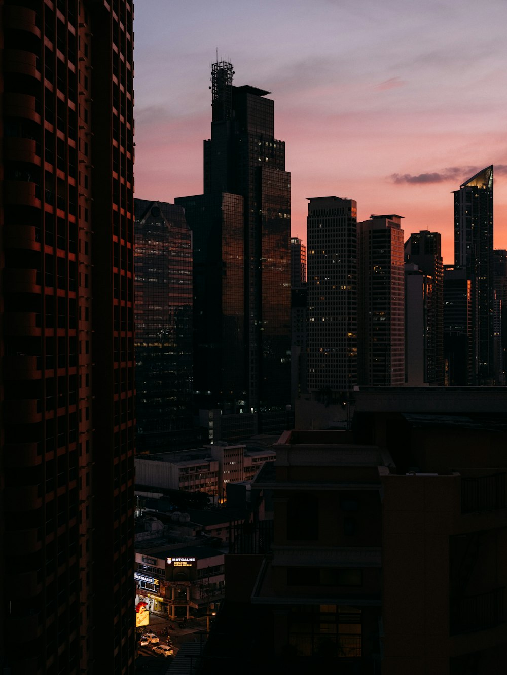 high rise buildings during sunset