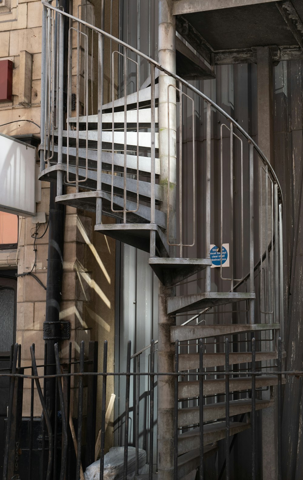 white and brown spiral staircase