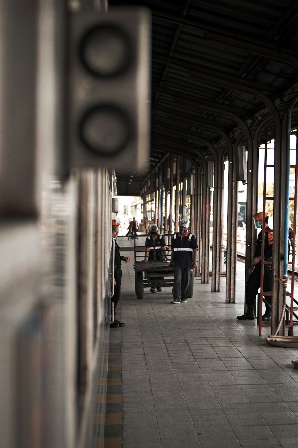 people sitting on bench inside train station