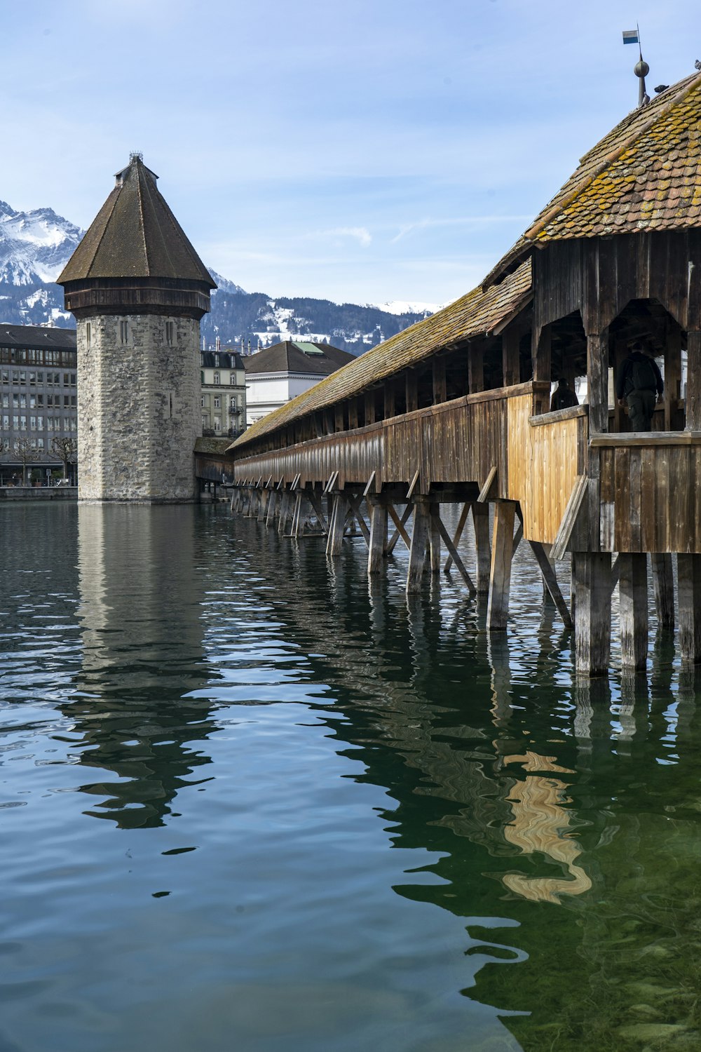 brown wooden dock on body of water during daytime