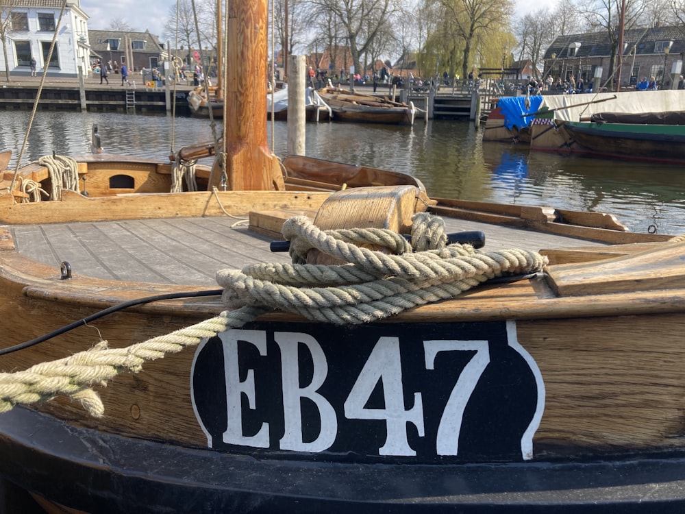 brown wooden boat on water during daytime