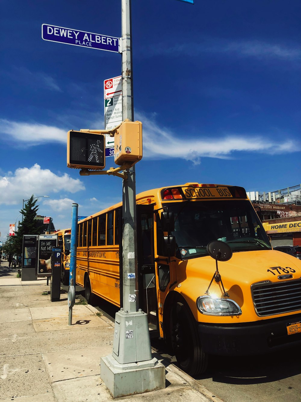 yellow school bus on road during daytime