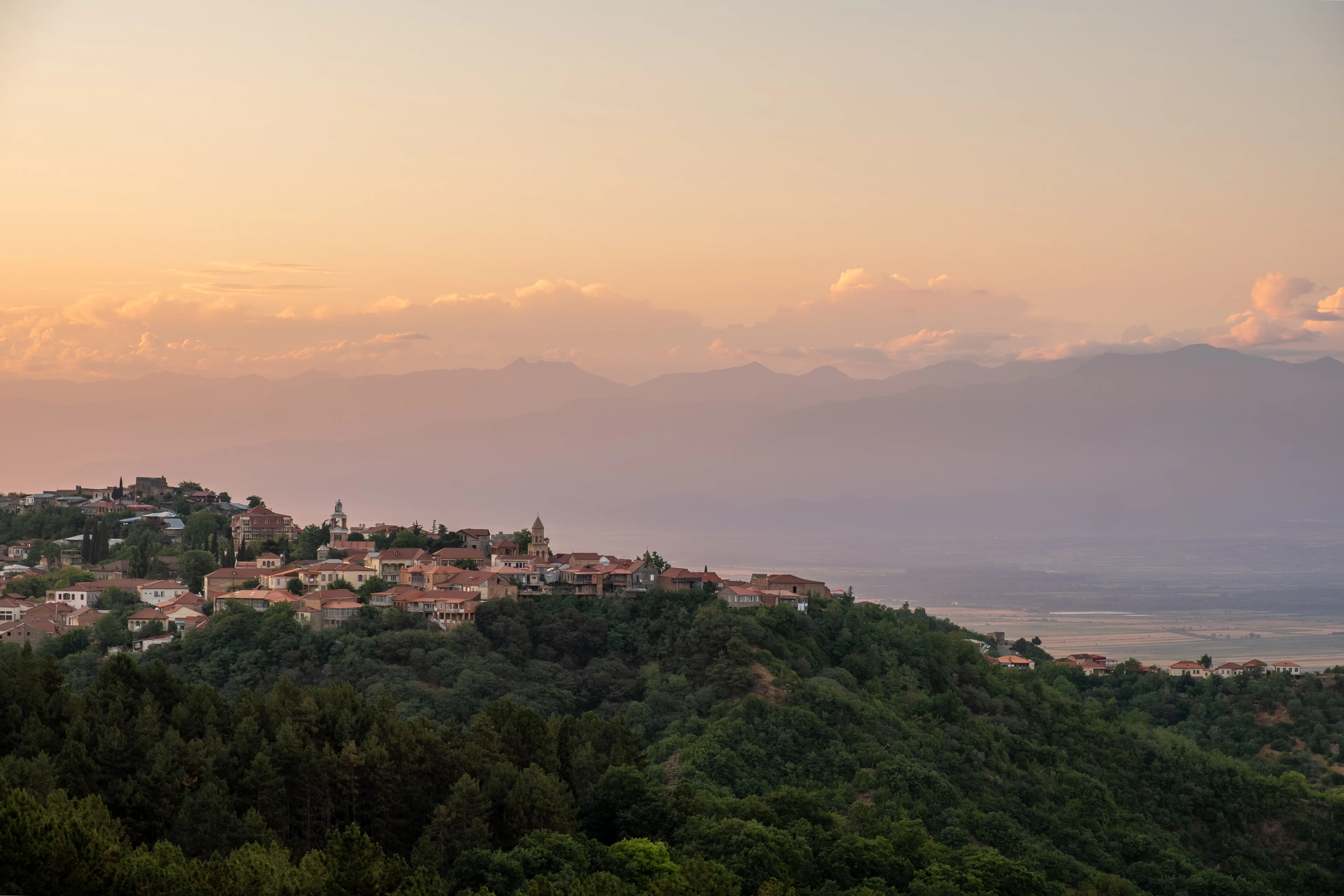 The hilltop town of Sighnaghi above the Kakheti plain, with the Caucasus behind