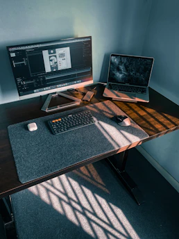 A modern workspace setup highlighting productivity software with glowing UI elements.