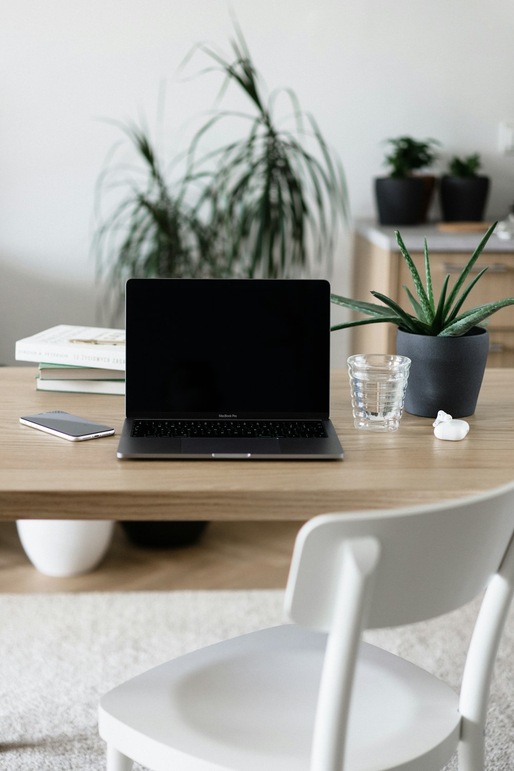 macbook pro on brown wooden table