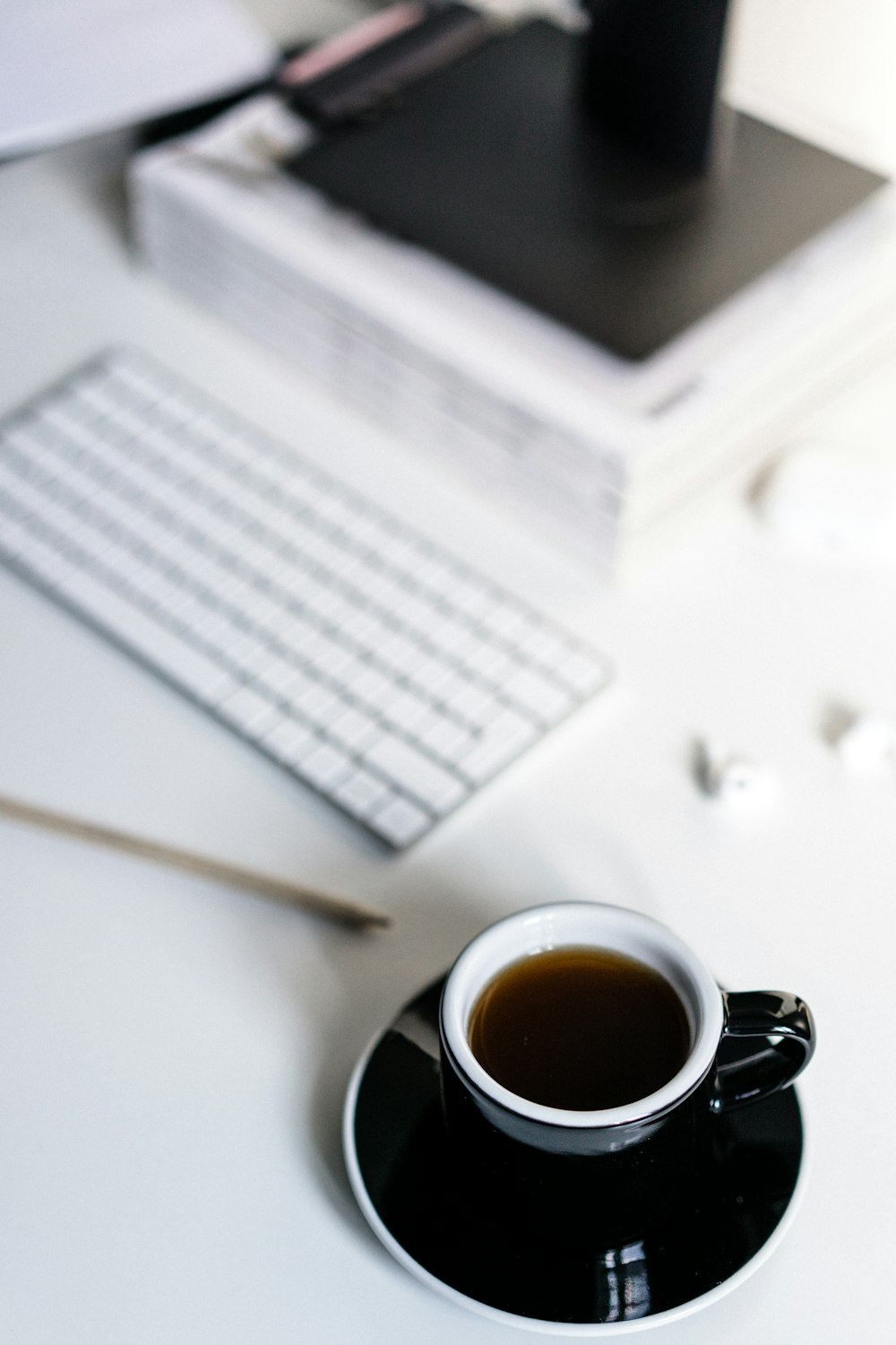 black ceramic mug on white paper