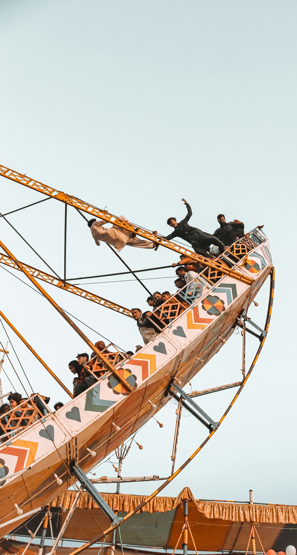 people riding on roller coaster during daytime