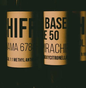 a close up of three bottles of wine