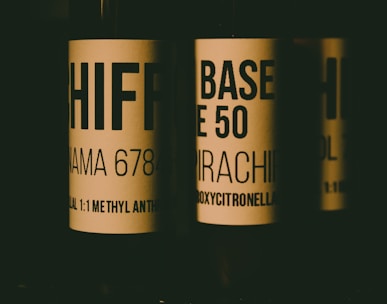 a close up of three bottles of wine