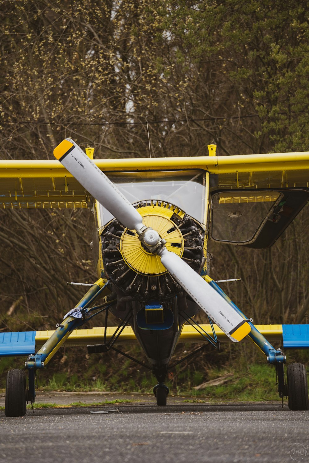 yellow and black propeller plane toy