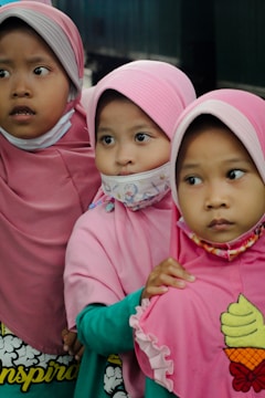 girl in pink hijab beside girl in pink hijab