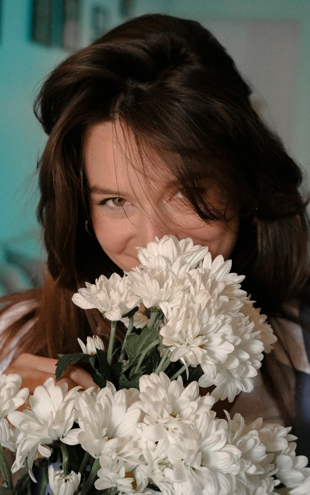 woman holding white flower bouquet