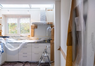 white wooden cabinet near window