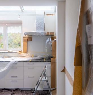 white wooden cabinet near window