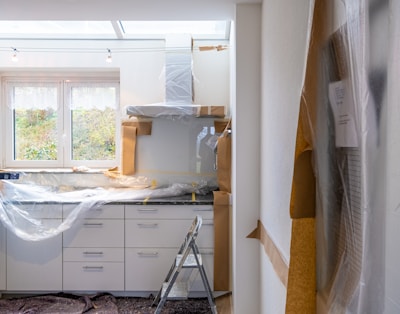 white wooden cabinet near window