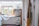 white wooden cabinet near window