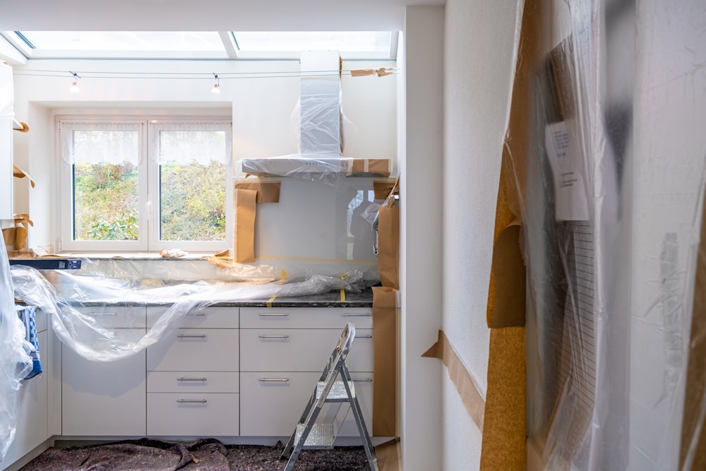 white wooden cabinet near window