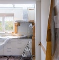 white wooden cabinet near window