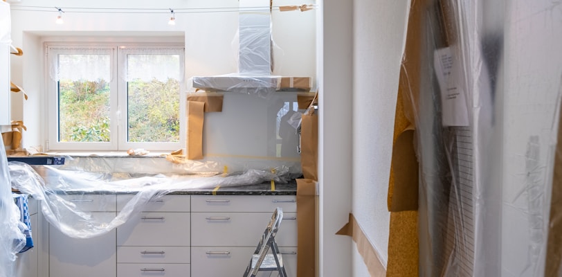 white wooden cabinet near window