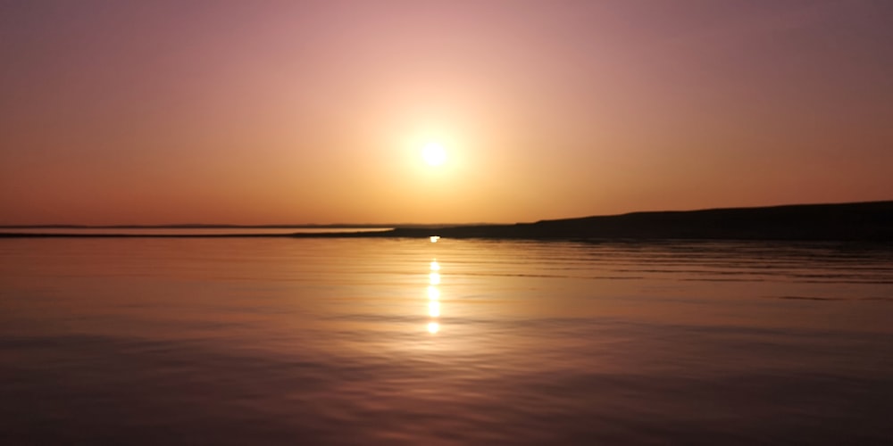 calm sea during golden hour